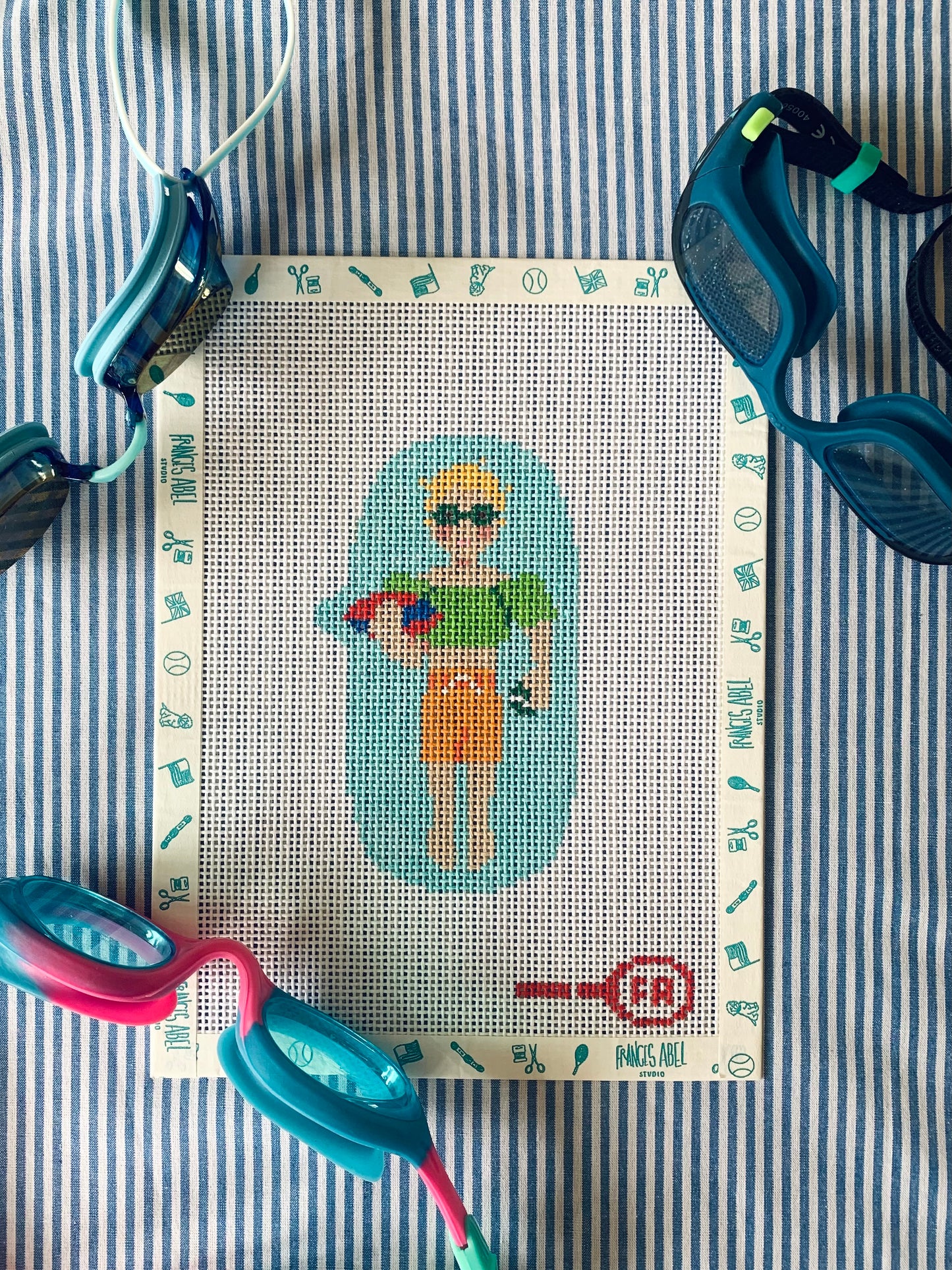 Pool Rats boy needlepoint canvas kit—boy swimmer in green trunks with red flippers on aqua pool, 13-mesh DIY