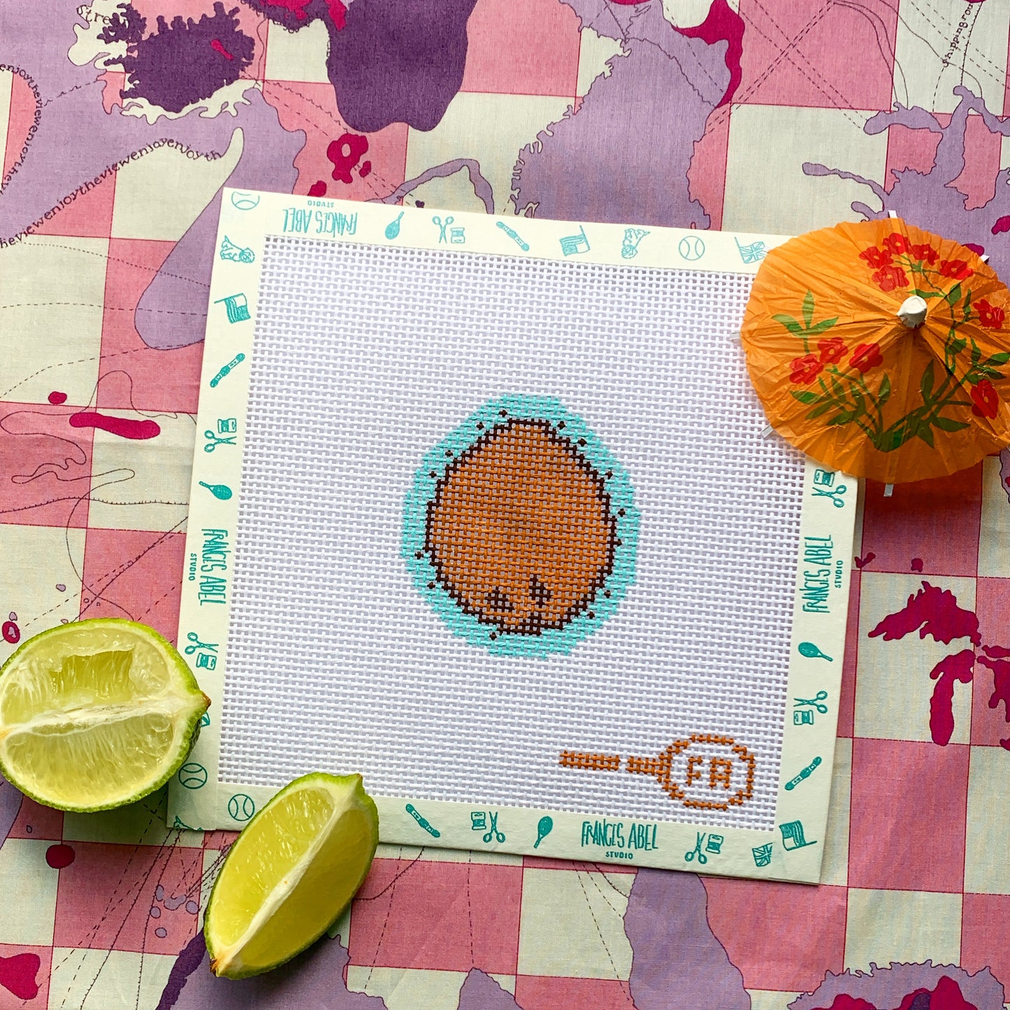 Mini coconut needlepoint canvas kit—brown coconut with aqua splash outline, 2.5 × 2.7 in on 13-mesh, DIY tropical ornament