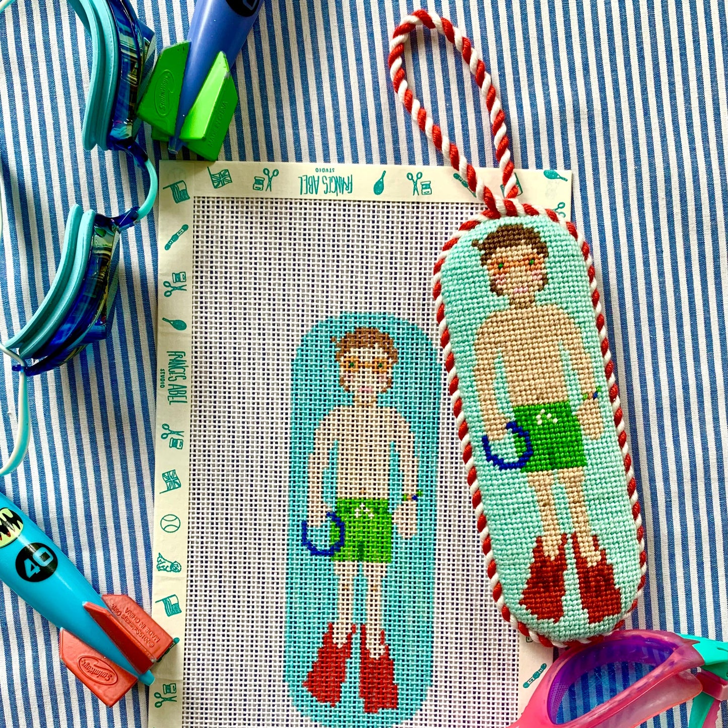 Pool Rats boy needlepoint canvas kit—retro swimmer in green trunks with red flippers on aqua pool, 13-mesh DIY craft