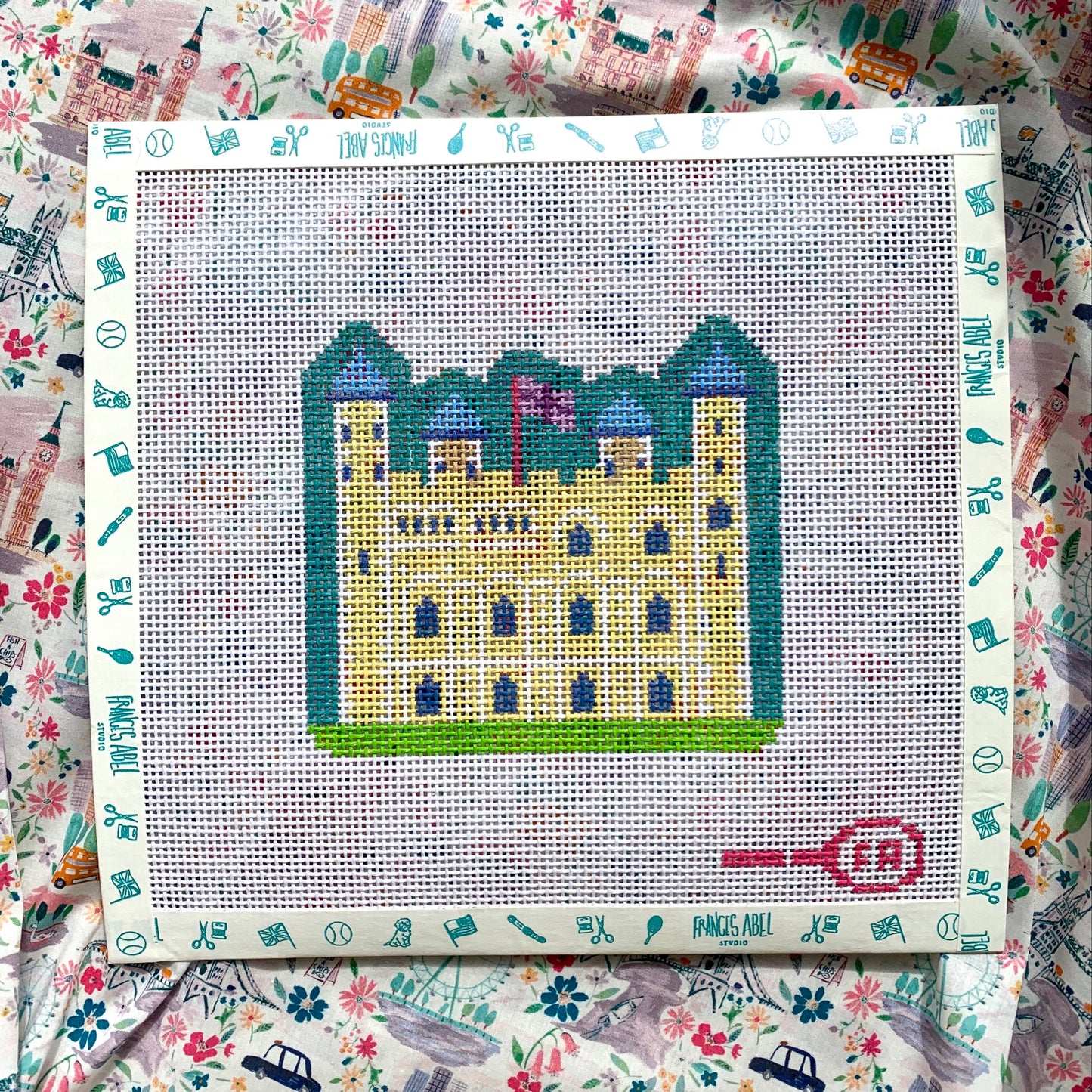Tower of London needlepoint canvas kit—stylized fortress silhouette in bold pink and teal, 4.75 × 4.25″ on 13-mesh DIY décor project
