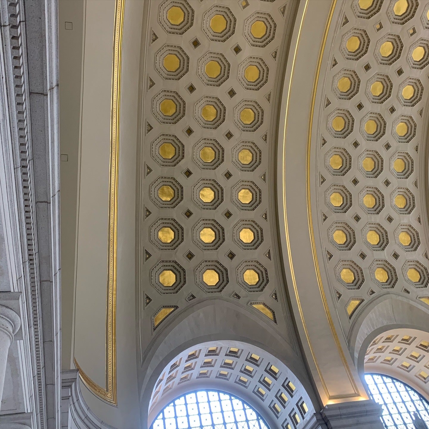 Interior ceiling of Union Station, Washington DC—arched windows beneath a coffered dome of octagonal gold panels