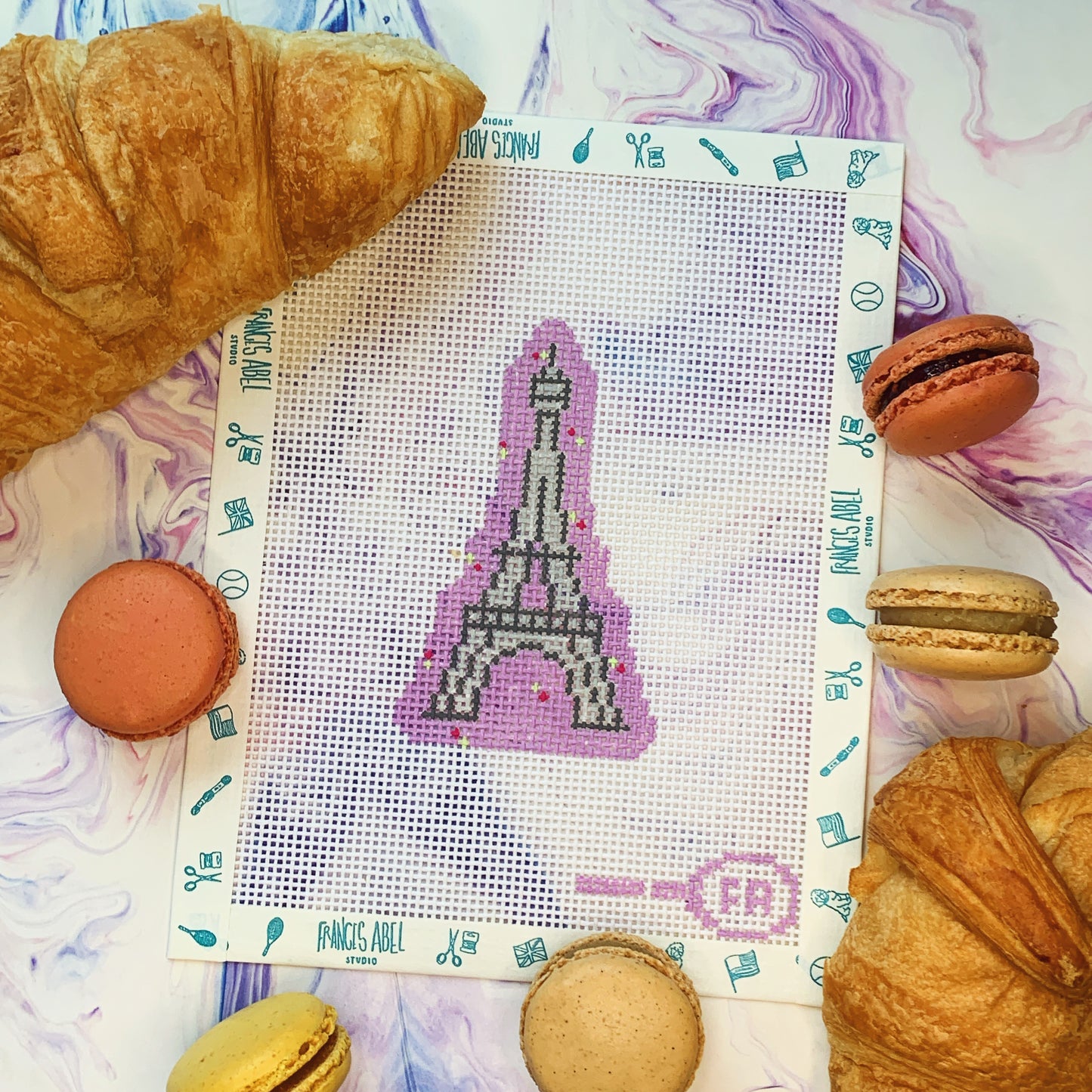 Mini Eiffel Tower needlepoint canvas—iconic Eiffel Tower silhouette with purple background painted on natural 13-mesh 2½ × 3¾″ canvas sheet for DIY ornament or fob 
