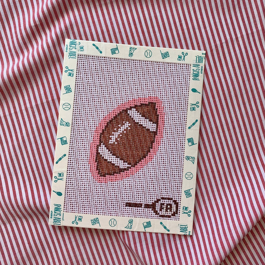 Mini footballneedlepoint canvas—small football on pink background natural 13-mesh canvas, 3⅛ × 2¼″ DIY whimsical décor project
