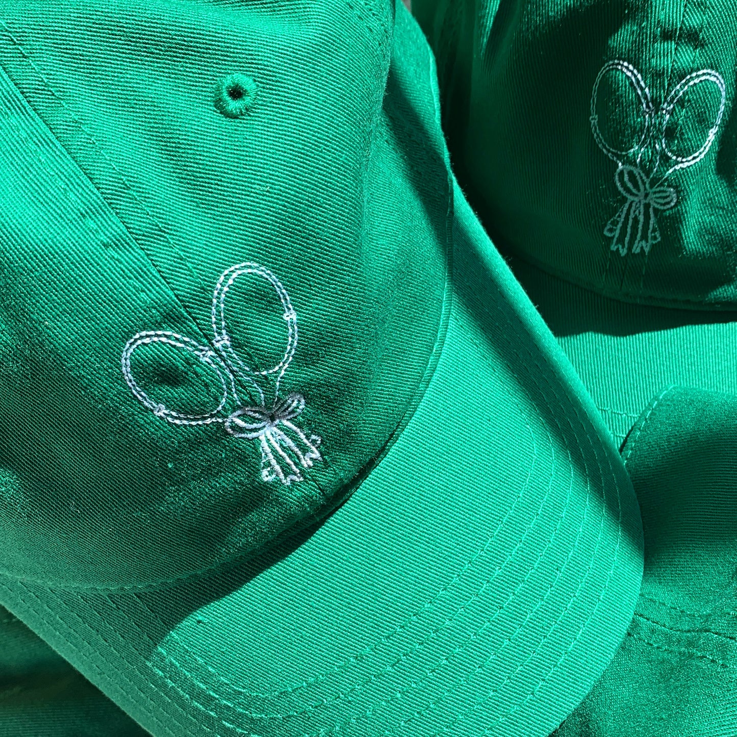 baseball cap with tennis rackets and bow embroidered