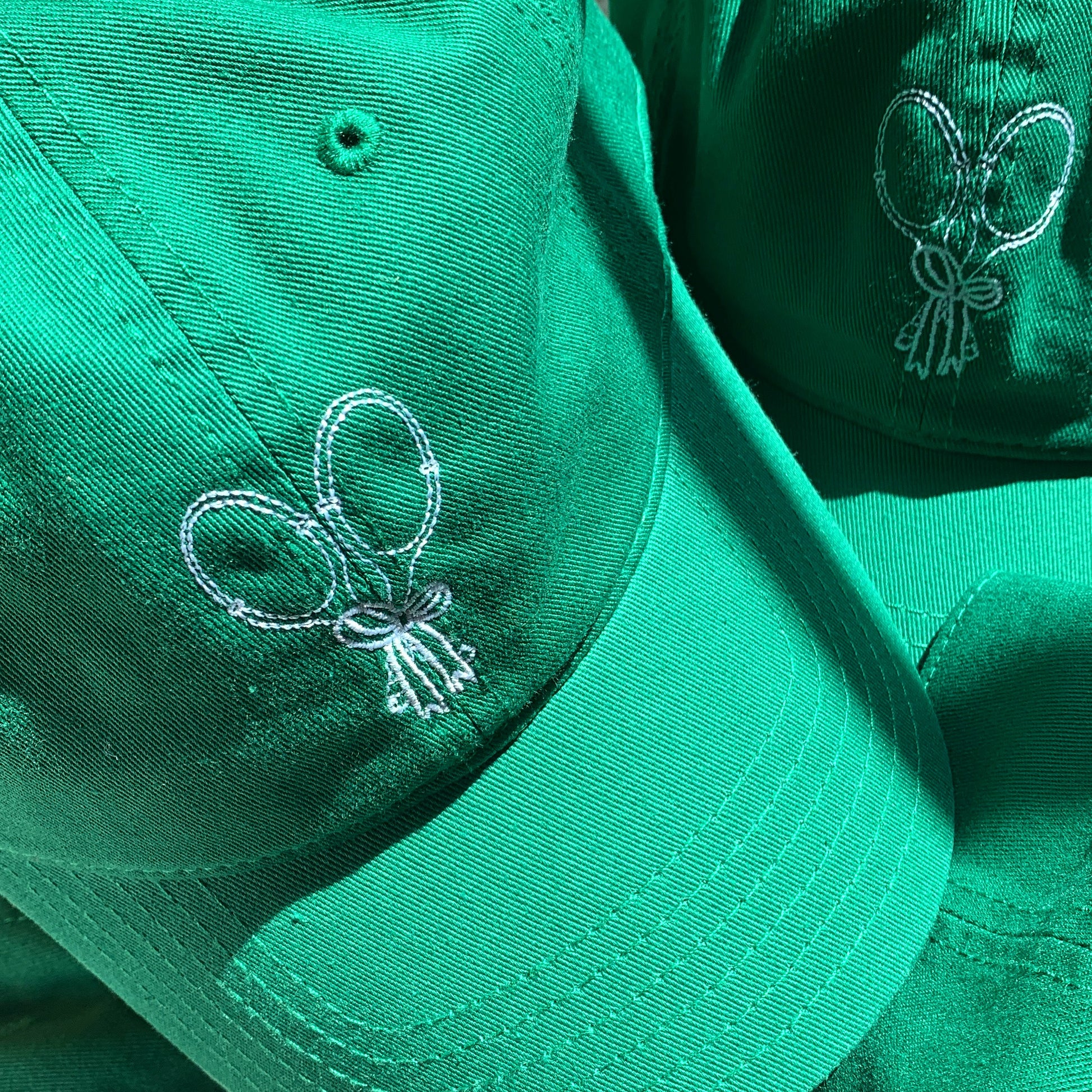 baseball cap with tennis rackets and bow embroidered