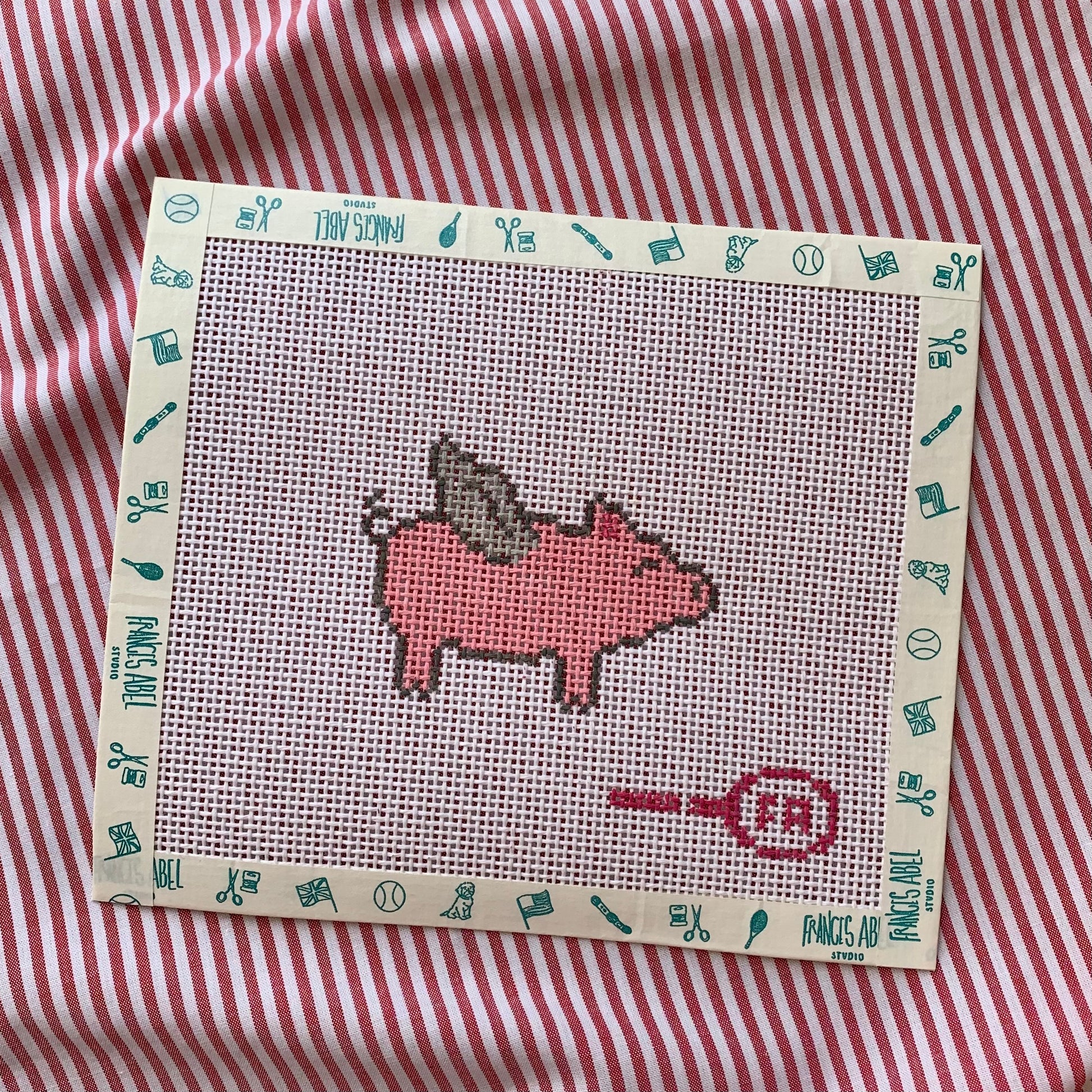 Mini Flying Piggie needlepoint canvas—pink pig with white wings on natural 13-hpi canvas, 3⅛ × 2¼″ DIY whimsical décor project 
