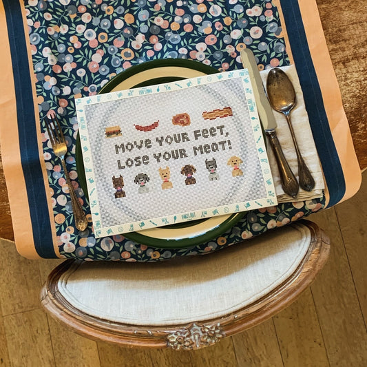 ‘Move your Feet, Lose your Meat!’ needlepoint canvas kit—playful typography pun for the kitchen, 7½ × 4¼″ on 13-mesh DIY décor 
