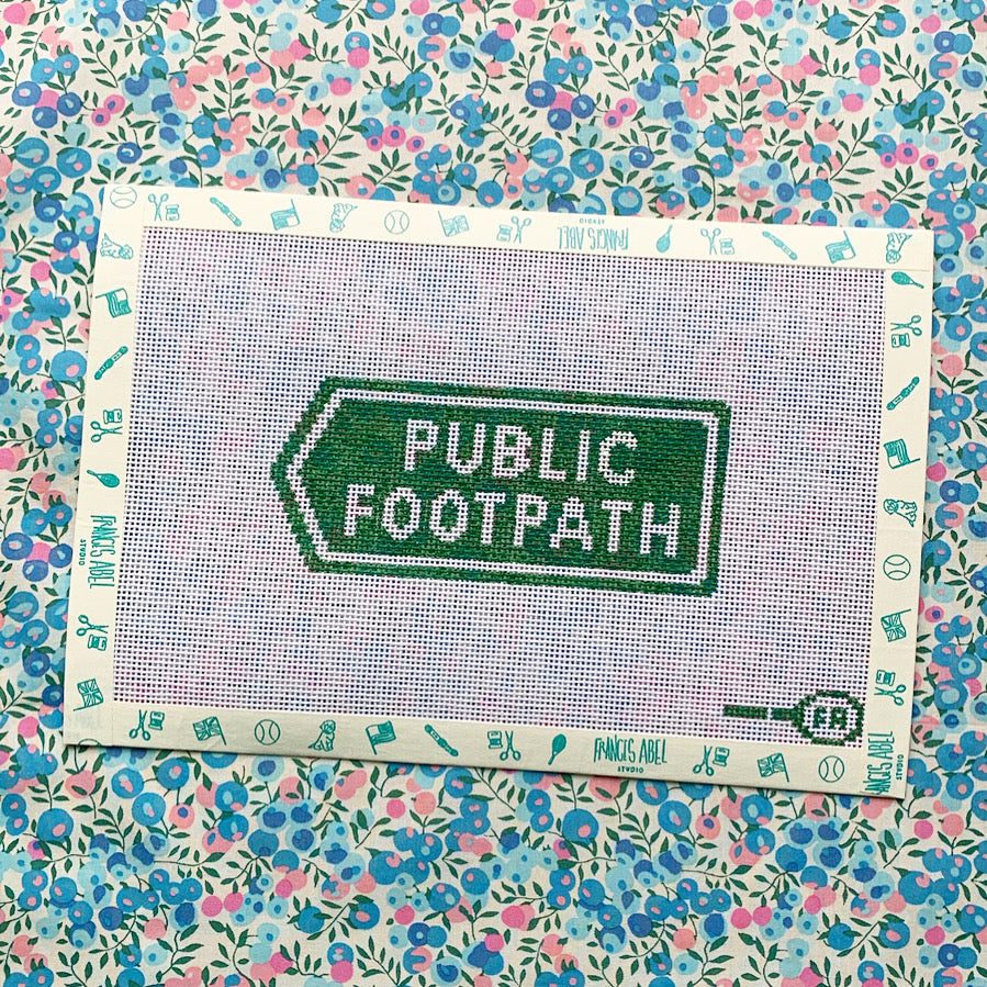 Public Footpath sign needlepoint canvas—green right-pointing arrow with white text, 4.75 × 2″ design for 13-mesh DIY canvas 
