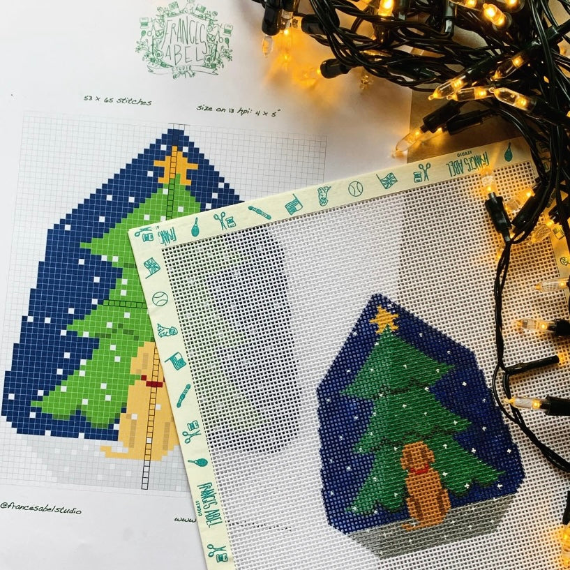 Silhouette of a dog looking at a Christmas tree on natural 13-mesh canvas, Stitched size on 13 mesh will be approx. 4 x 5"

