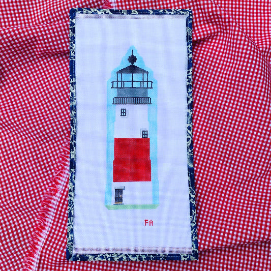 Sankaty Lighthouse needlepoint canvas featuring a bold red and white striped lighthouse with green grass and blue sky, hand-painted on 13 mesh.