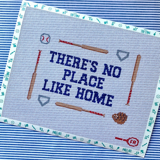 ‘There’s No Place Like Home’ pillow needlepoint canvas—navy text bordered by baseball bats, glove, ball & home plate, 8.75 × 6.5″ on 13-mesh DIY project 
