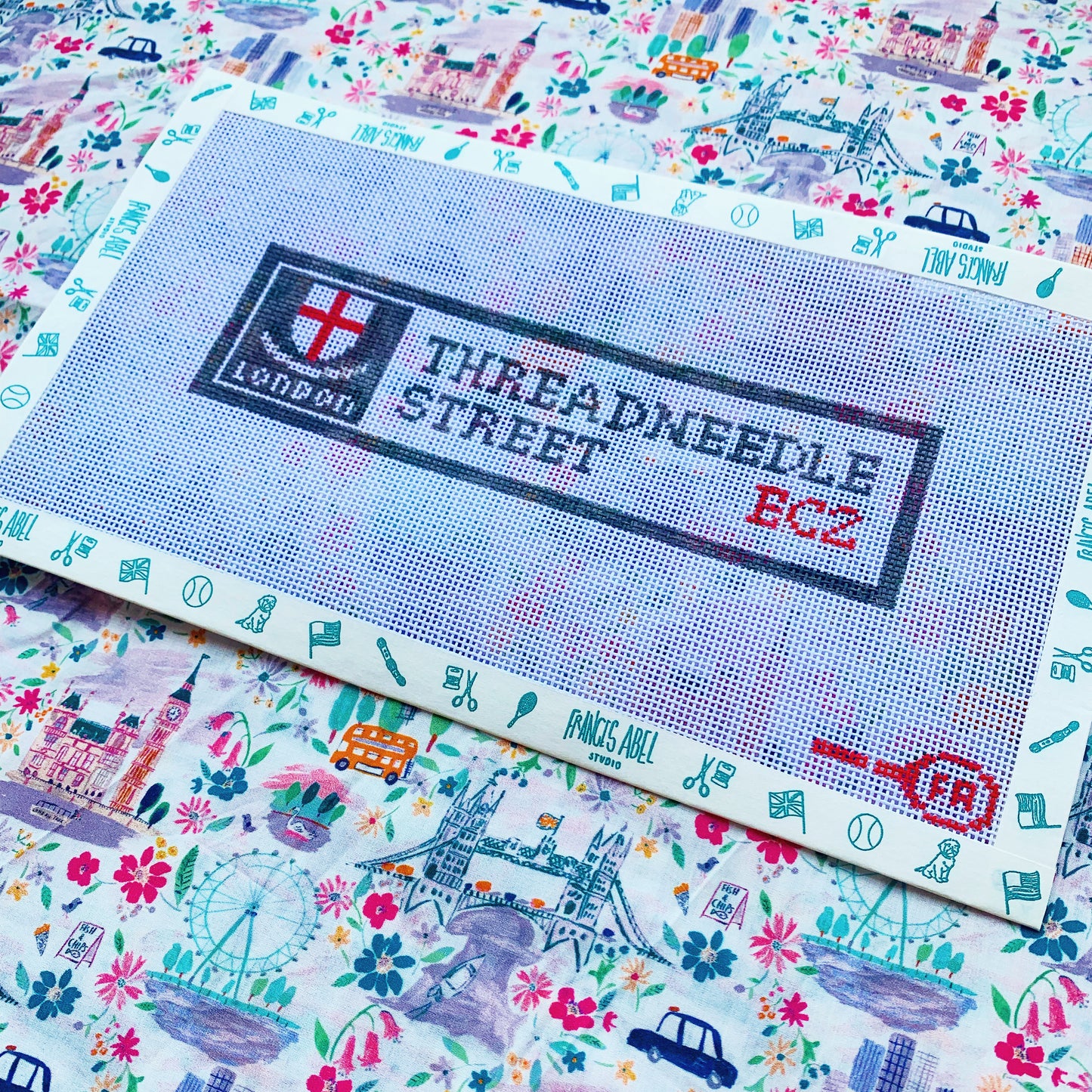 Threadneedle Street London needlepoint canvas kit—navy street-sign style background with white uppercase “THREADNEEDLE STREET” text on 14-mesh canvas, 4 × 2.5″ DIY décor project
